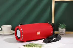 Portable wireless bluetooth speaker with deep bass, waterproof fabric design and carrying strap.