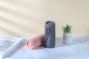 Portable waterproof bluetooth speaker in detail scene view, dual speakers with colorful lights.