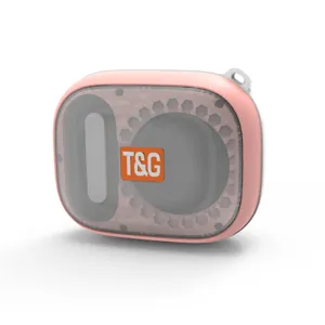 Pink portable Bluetooth speaker detail showing mesh grille and T&G brand logo texture.