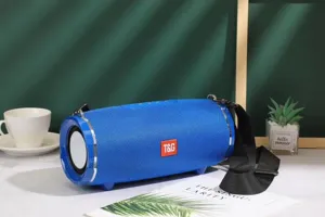 Blue cylindrical portable bluetooth speaker with fabric mesh, dual passive radiators and strap.