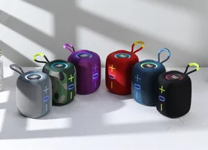 Multi-color portable wireless bluetooth speaker with LED light and hanging strap detail.