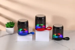 Portable wireless Bluetooth speaker with RGB LED lights, clear sound, and handy strap for outdoors.