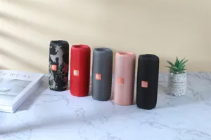 Portable waterproof bluetooth speaker with heavy bass and dual drivers for outdoor music playback.