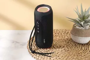 Portable wireless bluetooth speaker with fabric mesh and handy hanging strap design.