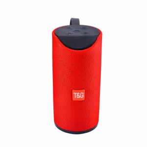 Portable wireless Bluetooth speaker detail view, compact red cylinder design with deep bass.
