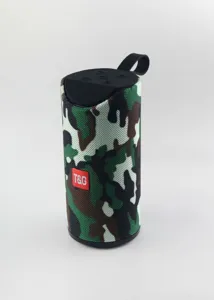 Close-up detail of the portable camouflage bluetooth speaker with control panel and T&G logo.