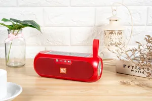 Portable solar bluetooth speaker in red with handle and control buttons for outdoor music.