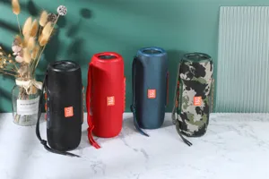 Haut-parleur Bluetooth sans fil portable avec sangle, design en tissu cylindrique.