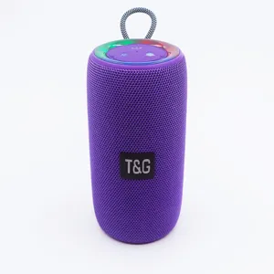 Tragbarer violetter kabelloser Bluetooth-Lautsprecher mit Stoffnetz und oberer Steuerung.