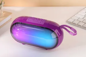 Portable wireless bluetooth speaker with colorful RGB lights and rich bass for desktop audio.