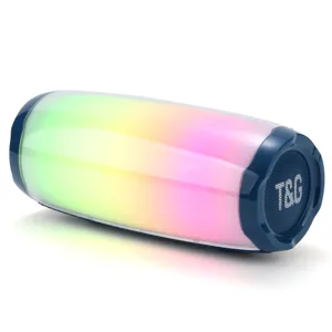 Détail de l'enceinte Bluetooth cylindrique présentant des lumières LED colorées et le logo.