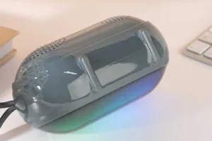 Portable wireless bluetooth speaker with RGB colorful lights, desktop TWS bass audio detail view.