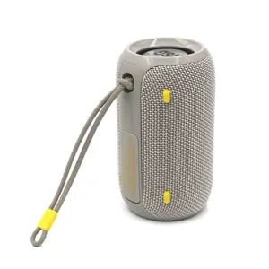 Portable wireless waterproof bluetooth speaker with fabric mesh and handy carrying strap.