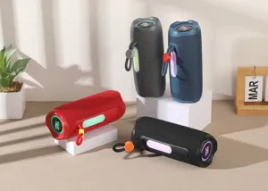 Portable wireless Bluetooth speaker with RGB lights and strap, perfect for outdoor music enjoyment.