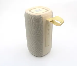 Portable wireless bluetooth speaker with fabric mesh and handy strap for outdoor music.