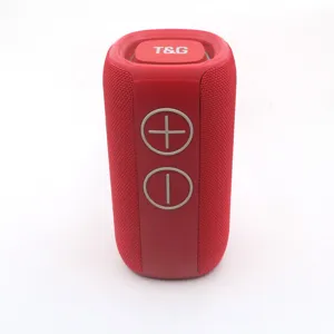 Portable red fabric mesh wireless Bluetooth speaker with large tactile control buttons detail.