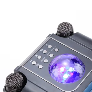 Portable wireless Bluetooth karaoke speaker detail shot with dual mics and colorful disco light.