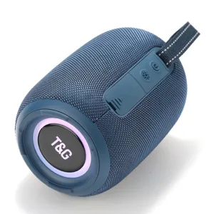 Gros plan détaillé du haut-parleur Bluetooth bleu portable avec filet en tissu et LED.