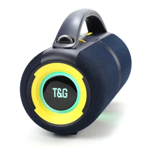 Portable outdoor Bluetooth speaker detail, blue cylindrical design with handle and LED ring.