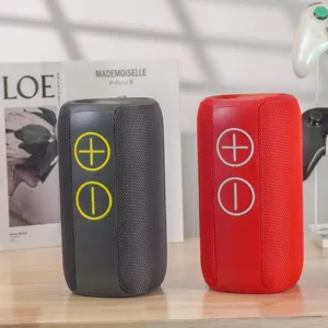 Portable wireless bluetooth speaker with mesh fabric design and volume buttons, dual color.