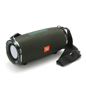 Outdoor waterproof portable Bluetooth speaker with fabric mesh, deep bass and carrying strap.