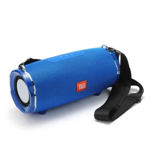 Portable blue bluetooth speaker with fabric mesh, strap, and dual diaphragms for outdoor use.