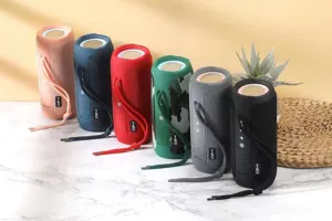 Portable wireless bluetooth speaker with fabric mesh design, waterproof and deep bass.