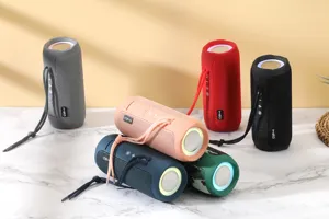 Portable wireless bluetooth speaker with fabric mesh design, waterproof stereo sound.