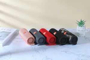 Portable bluetooth speaker detail showing multiple color options and fabric mesh design.