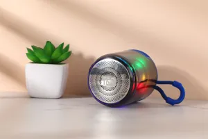 Portable wireless Bluetooth speaker with colorful LED lights and convenient hanging strap.