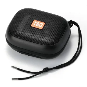 Portable wireless Bluetooth speaker close-up view with black mesh and orange badge detail.