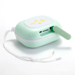 Close-up detail of the mint green portable bluetooth speaker port interface and control panel.