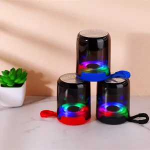 Portable Bluetooth speaker with colorful LED lights, wireless audio player for outdoor use.