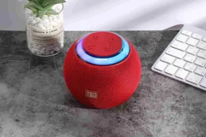 Portable spherical bluetooth speaker with colorful LED lights and wireless audio playback.