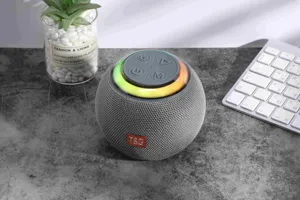 Portable round bluetooth speaker with colorful LED lights, wireless audio for outdoor desktop.