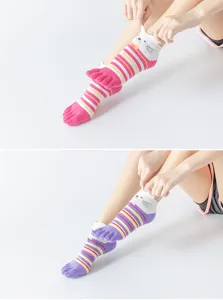 Details of non-slip five-toe yoga socks with cute cat face and striped design for fitness.