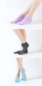 Detail view of open-back five toe yoga socks with non slip grip soles for pilates fitness.