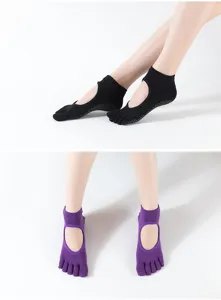 Detailed shot of non-slip yoga socks with cut-out back and five-toe design, perfect for pilates.