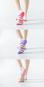 Detail view of anti-slip five-toe yoga socks with cute cat whiskers and grip dots.