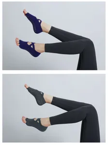 Close-up of non-slip five-toe yoga socks with cross straps, grip bottom, pilates detail.
