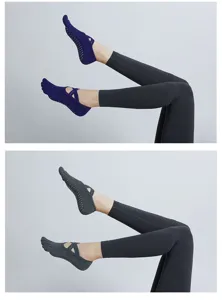 Detail view of non-slip five-toe yoga socks featuring secure grip dots and stylish cross straps.