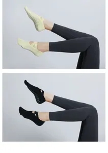 Five-toe non-slip yoga socks with cross straps for pilates, fitness, and home workouts.