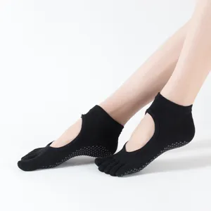 Non-slip five-toe yoga socks with open back design, perfect for pilates and fitness workouts.