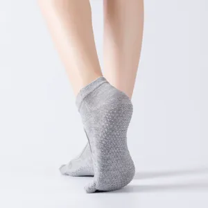 Professional non-slip yoga socks with five toes and open back design for pilates.