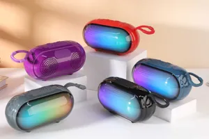 Portable wireless bluetooth speaker with RGB colorful light and convenient lanyard for outdoor use.
