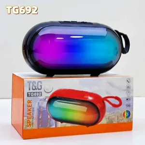 Close-up detail of portable wireless bluetooth speaker with vibrant RGB lights and strap.