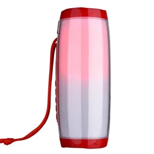 Haut-parleur Bluetooth sans fil portable avec lumières LED colorées et dragonne rouge pratique.