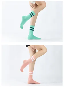 Detailed view of striped non-slip toe yoga socks with grip dots for women pilates dance.