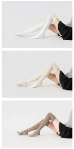 Detailed view of over-the-knee grip socks in white, beige, and brown for yoga and pilates workouts.