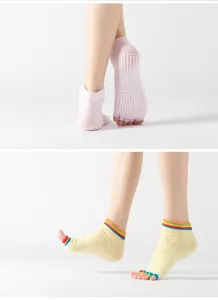 Detailed view of non-slip yoga toe socks with silicone grip dots on sole for stable balance.